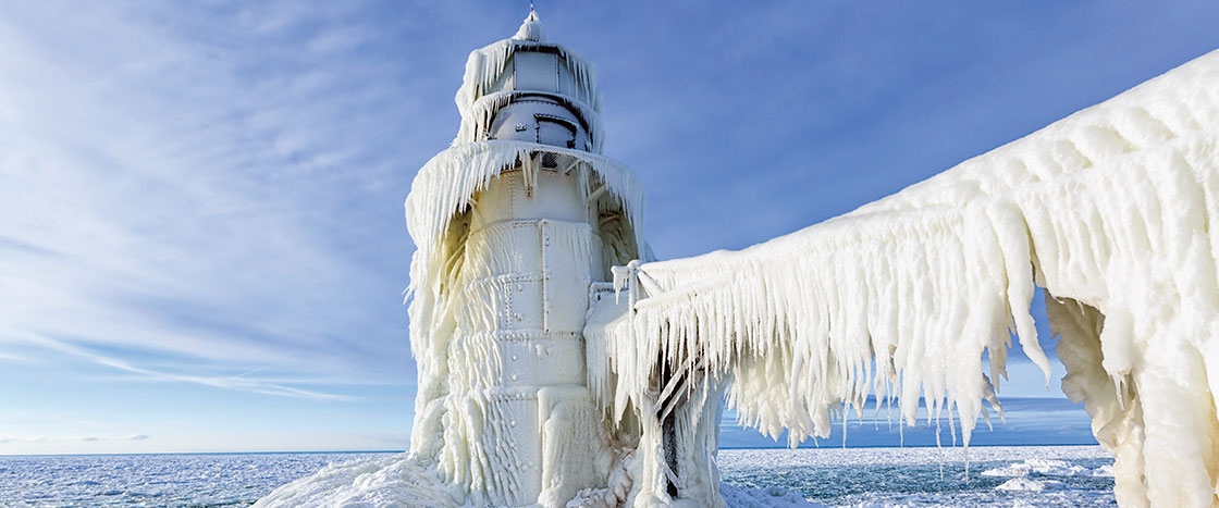 A lighthouse frosted over with ice