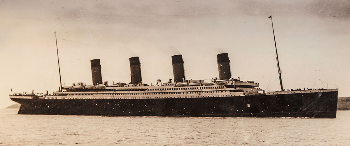 Black and white photo of the Titanic floating on the water