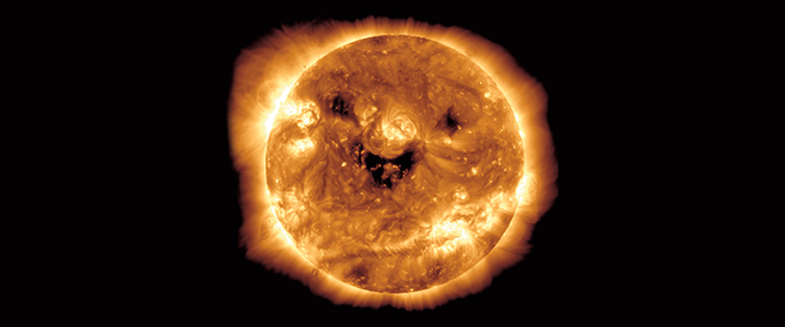 Image of the sun appearing to be smiling