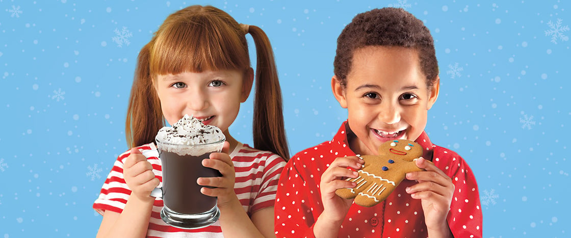 Image of kids with hot chocolate and gingerbread man cookie