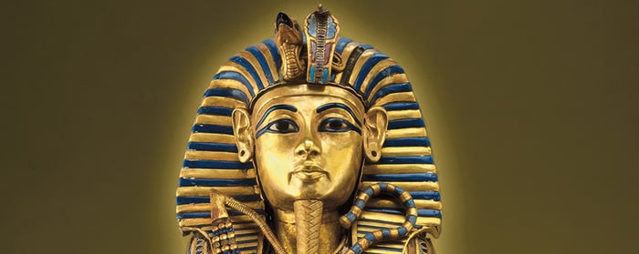 The golden burial mask of Tutankhamun with blue and gold striped headdress